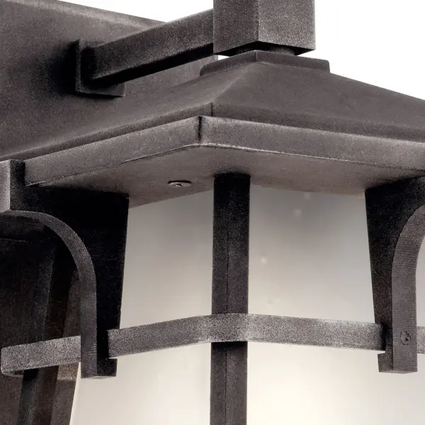 The Beckett Outdoor Wall Light combines transitional style with practical outdoor durability. Its weathered zinc finish and seeded glass shade create visual interest while providing reliable illumination for entryways and patios. - alternate view