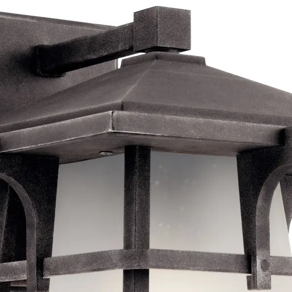 The Beckett Outdoor Wall Light combines transitional style with durable wet-rated construction. Its weathered zinc finish and seeded glass shade create visual interest while providing reliable outdoor illumination. - alternate view