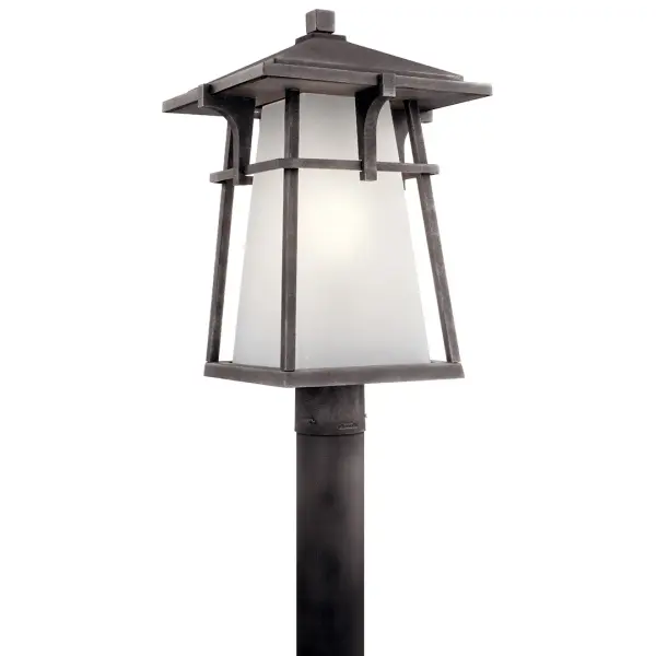 The Beckett Outdoor Post Light combines traditional styling with durable weathered zinc finish and seeded glass for timeless curb appeal. Wet-rated for all weather conditions with dimmable functionality.