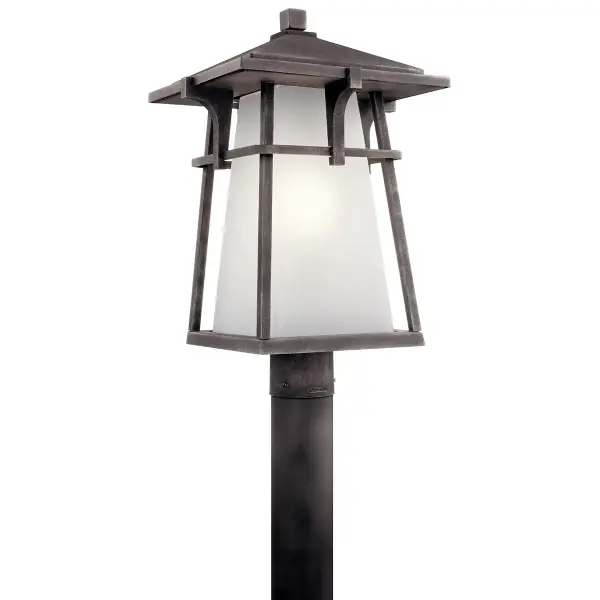 The Beckett outdoor post light combines traditional styling with durable weathered zinc finish and seeded glass. Wet-rated for all weather conditions, this 20-inch fixture provides reliable illumination for pathways and entryways.