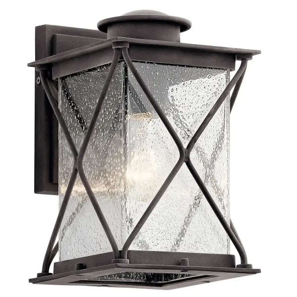 The Argyle Outdoor Wall Light combines farmhouse aesthetics with industrial durability. Its weathered zinc finish and seeded glass create authentic character while wet-rated construction ensures reliable outdoor performance.