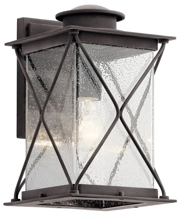 The Argyle Outdoor Wall Light combines farmhouse aesthetics with industrial durability. Its weathered zinc finish and clear seeded glass create authentic character while wet-rated construction ensures reliable performance in any weather.