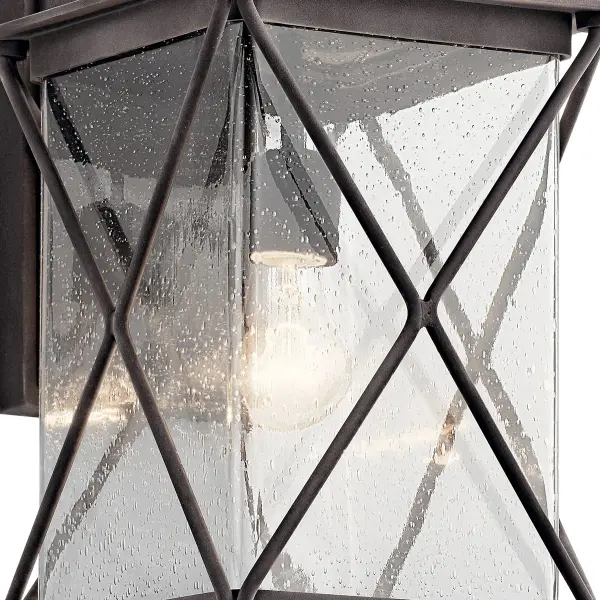 The Argyle Outdoor Wall Light combines weathered zinc finish with clear seeded glass for authentic farmhouse appeal. Wet-rated and dimmable, it delivers reliable performance in any weather while adding character to entryways and patios. - alternate view