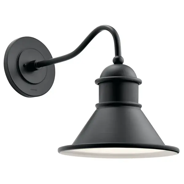 The Northland wall sconce combines industrial design with coastal durability. Its black aluminum construction with white interior creates visual depth while the wet-rated design ensures reliable outdoor performance.