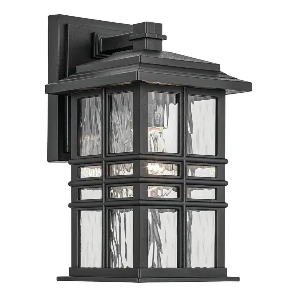 The Beacon Square combines timeless design with durable wet-rated construction. Its textured black finish and clear hammered glass create inviting illumination for entryways and outdoor living spaces.