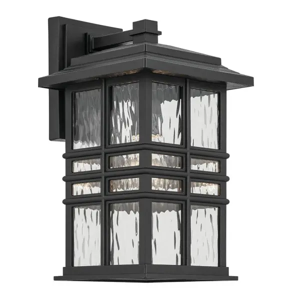 The Beacon Square combines timeless design with durable wet-rated construction. Its textured black finish and clear hammered glass create inviting illumination for entryways and outdoor living spaces.