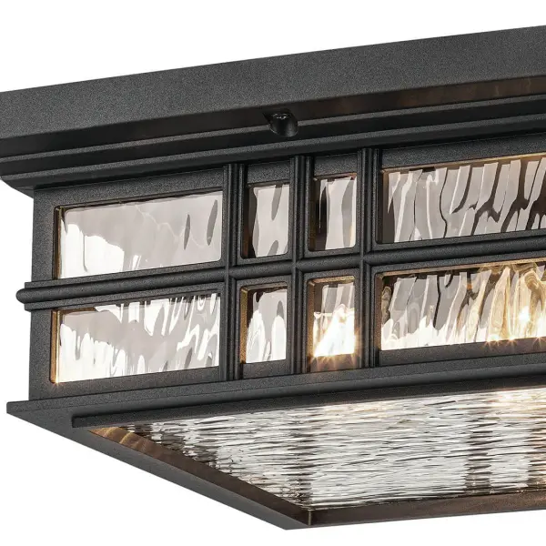 The Beacon Square combines classic design with modern durability. Its textured black finish and hammered glass create visual interest while the wet-rated construction ensures reliable performance in any weather. - alternate view