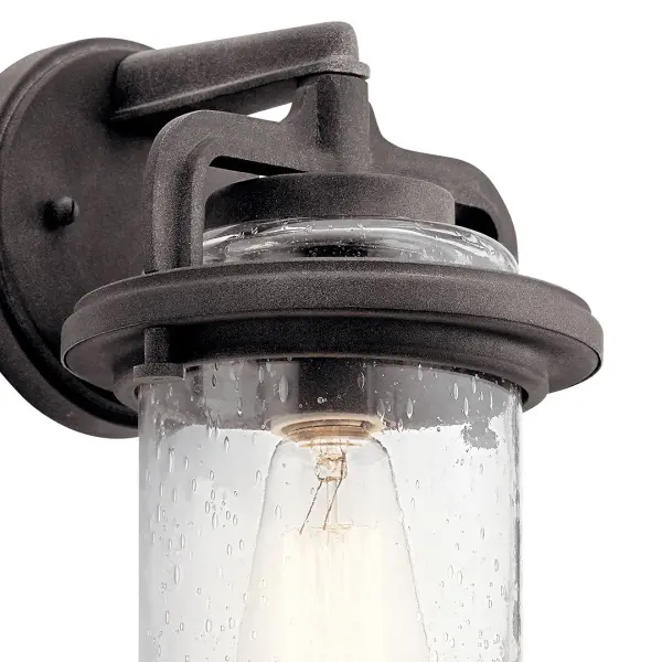 The Andover brings rustic charm to outdoor spaces with its weathered zinc finish and clear seeded glass. This compact 1-light fixture offers wet-rated durability and dimmable functionality, perfect for creating welcoming entryways. - alternate view