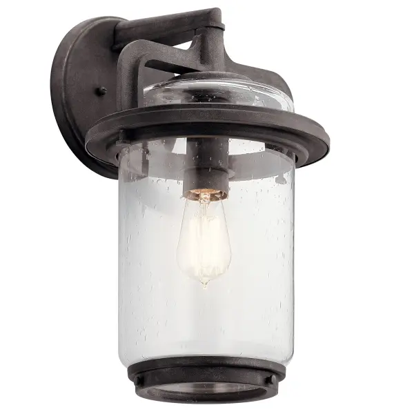 The Andover Outdoor Wall Light combines farmhouse aesthetics with wet-rated durability. Its weathered zinc finish and clear seeded glass create authentic rustic appeal while providing reliable outdoor illumination.