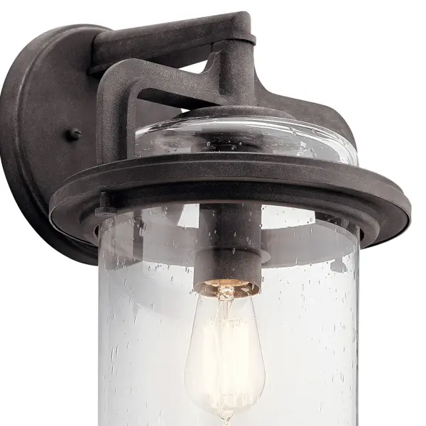 The Andover Outdoor Wall Light combines farmhouse aesthetics with wet-rated durability. Its weathered zinc finish and clear seeded glass create authentic rustic appeal while providing reliable outdoor illumination. - alternate view