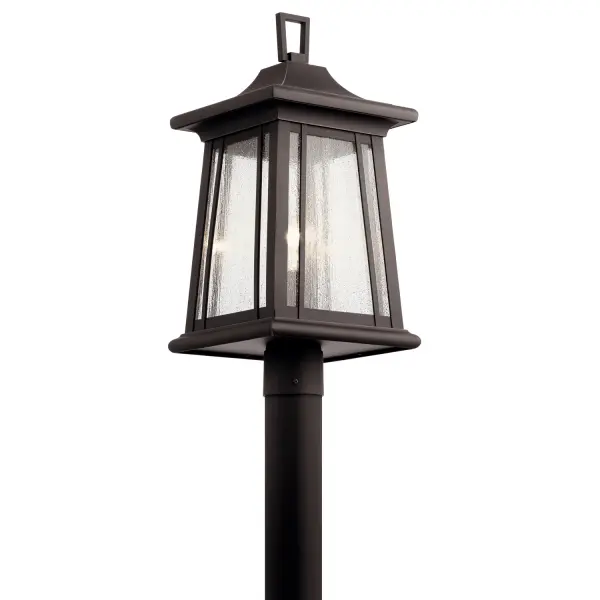 The Taden post lantern brings timeless Arts and Crafts beauty to outdoor spaces with its tapered silhouette, seeded glass, and bronze finish accented with gold highlights. Wet-rated for durability and versatile styling.