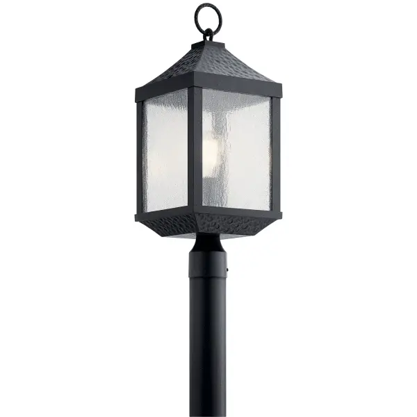 The Springfield post mount brings rustic character to outdoor spaces with its hammered metal texture and distressed black finish. The seeded glass creates a warm, diffused glow perfect for pathways and entryways.