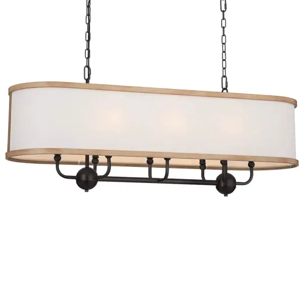 The Heddle Linear Chandelier combines industrial-inspired Anvil Iron finish with soft fabric drum shades, creating a perfect balance of rustic charm and refined sophistication for dining spaces and kitchen islands.