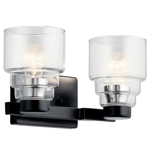 The Vionnet 2-light vanity fixture delivers modern sophistication with its matte black finish and clear glass shades. At 14.5 inches wide, it's perfectly sized for smaller vanities while providing ample task lighting.