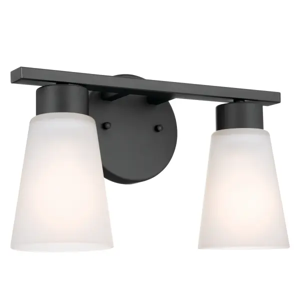 The Stamos 2-light bath fixture delivers functional illumination with transitional styling. Its black steel frame and satin etched glass shades provide even, glare-free light ideal for grooming tasks.