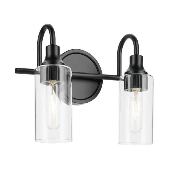 The Kavi 2-light vanity fixture brings European elegance to modern bathrooms with its sleek curves and fluted socket detailing. Clear glass shades provide excellent task lighting while the compact 12.5-inch width fits most vanity spaces.