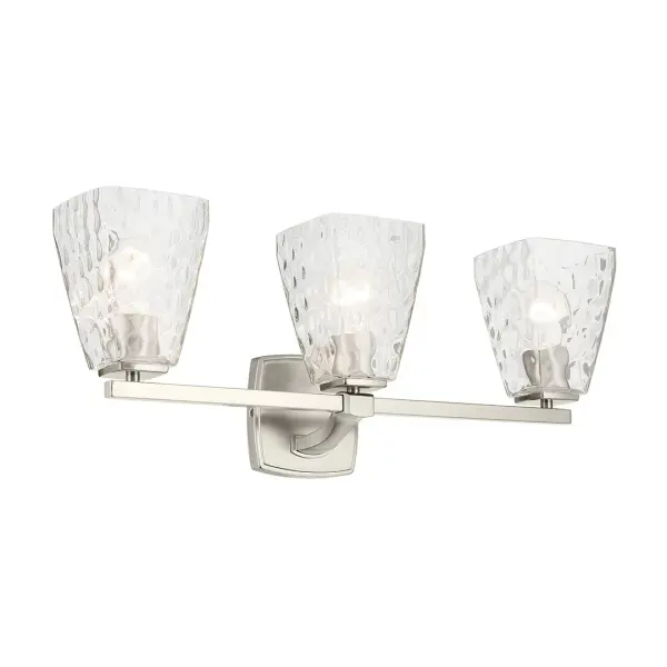 The Marant 3-Light Vanity Light combines brushed nickel finish with clear water glass tapered shades for a sophisticated bathroom lighting solution. Dimmable and damp-rated for versatile installation.