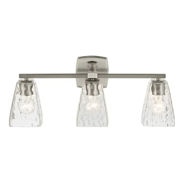 The Marant 3-Light Vanity Light combines brushed nickel finish with clear water glass tapered shades for a sophisticated bathroom lighting solution. Dimmable and damp-rated for versatile installation. - alternate view