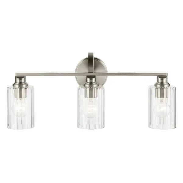 The Gioe 3-Light Vanity Light combines classic fluted glass cylinders with a clean brushed nickel finish, creating a versatile fixture that works in both traditional and contemporary bathrooms. Dimmable and damp-rated for bathroom use. - alternate view