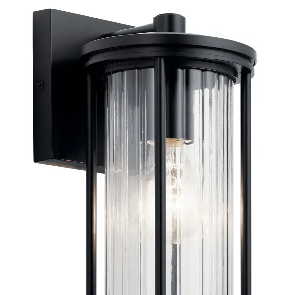 The Barras outdoor wall light combines contemporary styling with practical outdoor performance. Its Dark Sky compliant design minimizes light pollution while the clear ribbed glass adds textural interest to any exterior space. - alternate view
