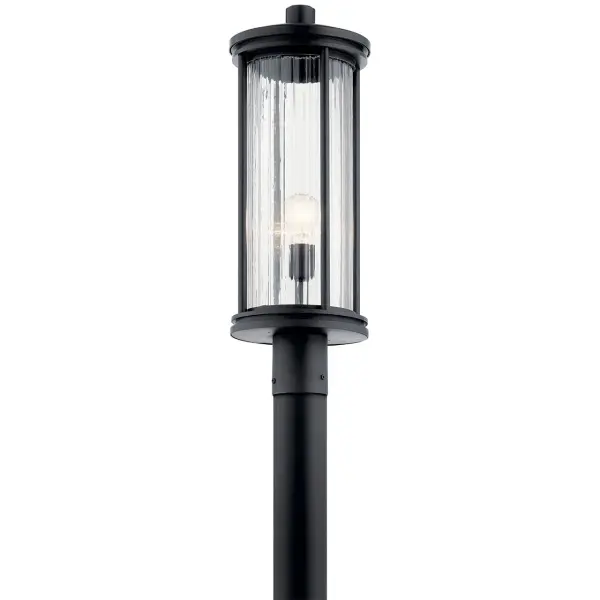 The Barras outdoor post light combines timeless design with durable wet-rated construction. Its clear ribbed glass shade and black finish create elegant curb appeal while providing reliable illumination for pathways and entryways.