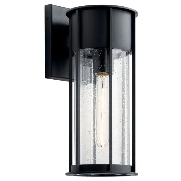 The Camillo outdoor wall light combines textured black finish with clear seeded glass for a timeless look. Wet-rated and dimmable, it's perfect for porches, patios, and entryways needing reliable outdoor illumination.