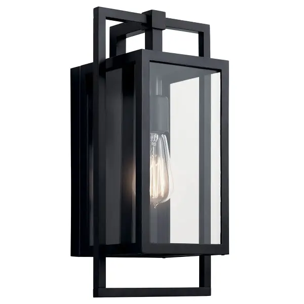 The Goson outdoor wall light combines modern design with practical functionality. Featuring a sleek black finish and clear glass shade, this wet-rated fixture is built for durability in any weather condition.