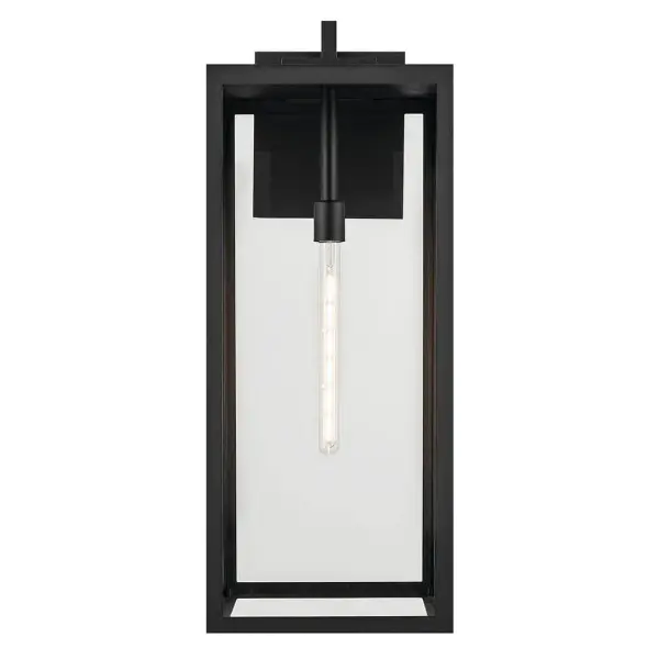 The Branner outdoor wall light combines industrial-inspired design with weather-resistant construction. Its textured black finish and clear glass shade create dramatic curb appeal while standing up to the elements. - alternate view