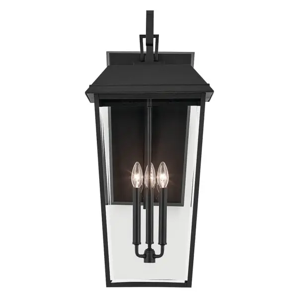 The Mathus 3-light outdoor wall sconce combines classic design with durable wet-rated construction. Its textured black finish and clear beveled glass panels create sophisticated illumination for entryways and outdoor living spaces. - alternate view