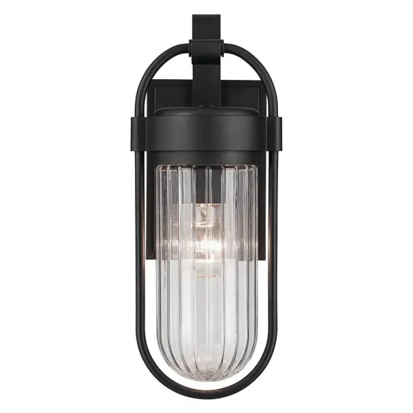 The Brix outdoor wall light combines contemporary design with industrial styling in a compact 16-inch fixture. Featuring clear glass and textured black finish, it's wet-rated for full weather exposure. - alternate view