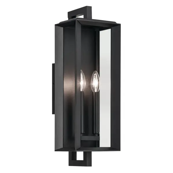 The Kroft outdoor wall sconce combines practical weather protection with clean transitional styling. Its corner channel design prevents water intrusion while thick clear glass panes showcase dual candle-style bulbs.