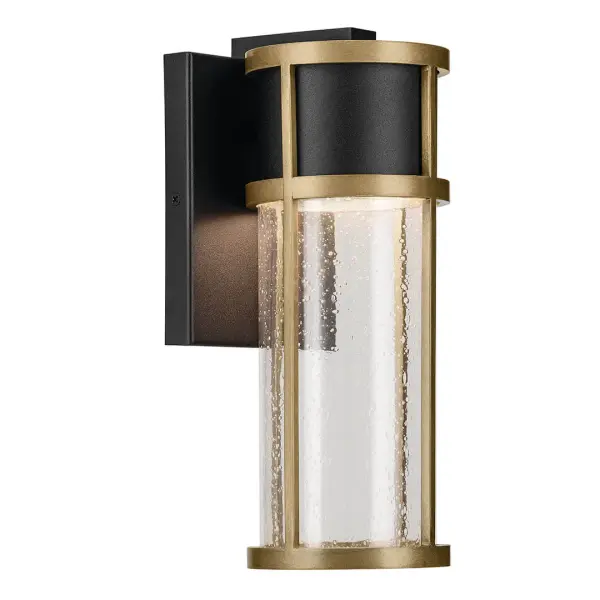 The Camillo combines textured black finish with natural brass accents and clear seeded glass for a contemporary outdoor aesthetic. Integrated LED technology provides energy-efficient illumination with wet location rating.