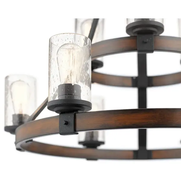 The Barrington brings rustic charm with its distressed black finish and clear seeded glass shades. This 9-light multi-tier design creates dramatic visual impact perfect for large dining spaces and entryways. - alternate view