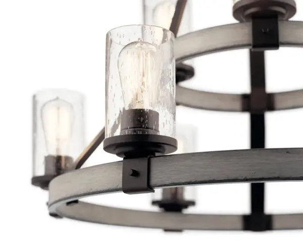 The Barrington brings farmhouse sophistication with its multi-tier design, combining distressed wood tones and anvil iron finish. Nine lights with seeded glass create warm ambiance perfect for large dining spaces and grand entryways. - alternate view