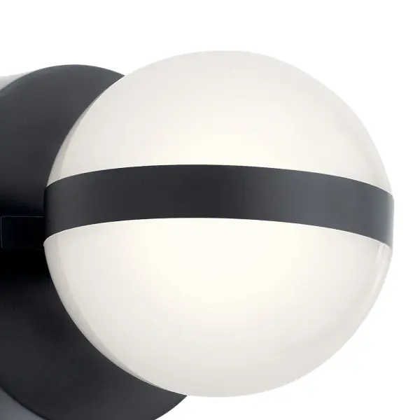 The Brettin Wall Sconce combines contemporary minimalist design with energy-efficient integrated LED technology. Its compact 5.25-inch profile and matte black finish make it ideal for modern bathrooms and hallways. - alternate view