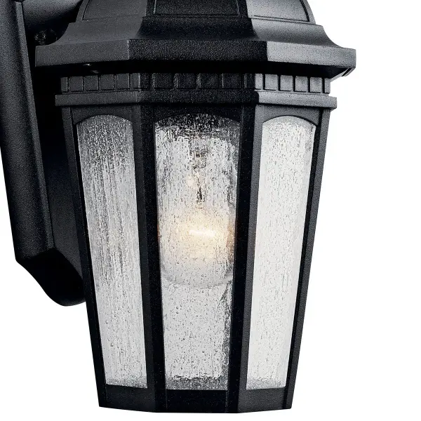The Courtyard Outdoor Wall Light combines traditional styling with durable wet-rated construction. Its textured black finish and clear seeded glass create welcoming illumination for entryways and outdoor spaces. - alternate view