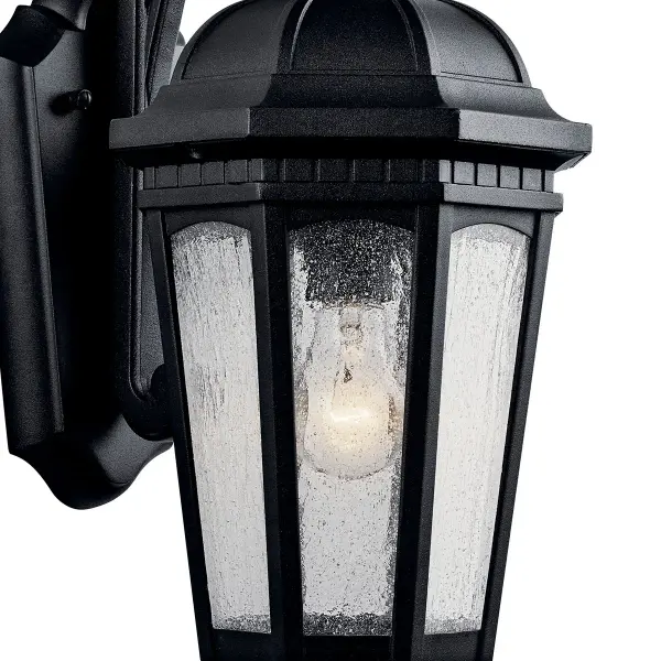 The Courtyard Outdoor Wall Light combines traditional styling with durable wet-rated construction. Its textured black finish and clear seeded glass create welcoming illumination for entryways and outdoor spaces. - alternate view