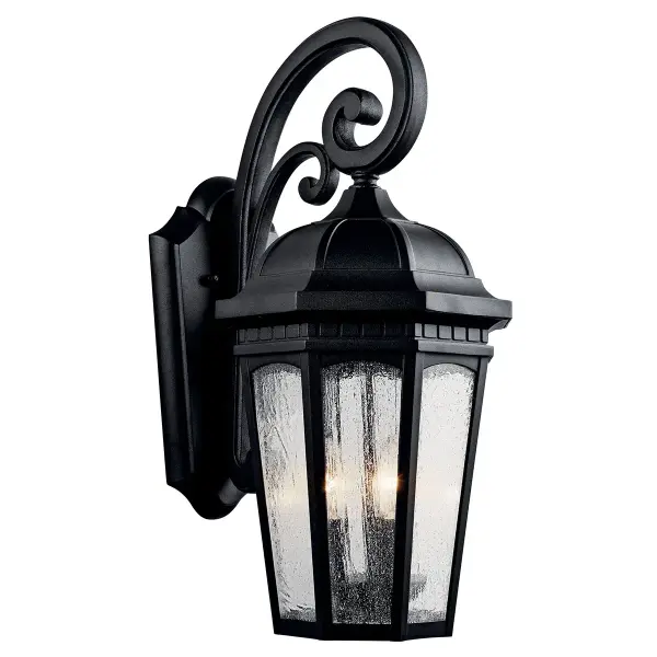 The Courtyard 3-Light Outdoor Wall Light combines traditional styling with durable wet-rated construction. Its textured black finish and clear seeded glass create welcoming illumination for entryways and outdoor living spaces.