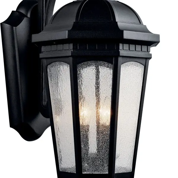 The Courtyard 3-Light Outdoor Wall Light combines traditional styling with durable wet-rated construction. Its textured black finish and clear seeded glass create welcoming illumination for entryways and outdoor living spaces. - alternate view