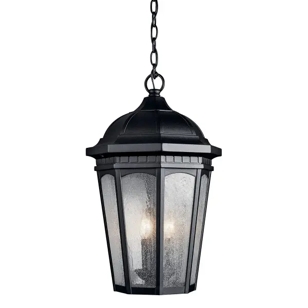 The Courtyard 3-Light Outdoor Hanging Light combines traditional design with durable outdoor construction. Its textured black finish and clear seeded glass create warm, inviting illumination for covered outdoor spaces.