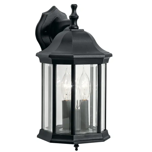 The Chesapeake 3-light outdoor wall sconce combines traditional styling with durable wet-rated construction. Clear beveled glass panels and a clean black finish create a versatile look suitable for various architectural styles.