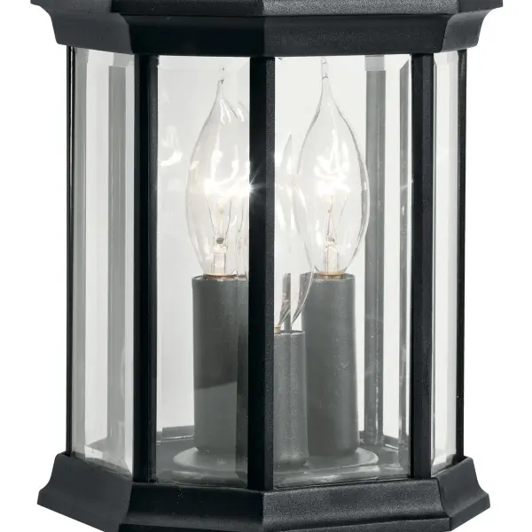 The Chesapeake 3-light outdoor wall sconce combines traditional styling with durable wet-rated construction. Clear beveled glass panels and a clean black finish create a versatile look suitable for various architectural styles. - alternate view