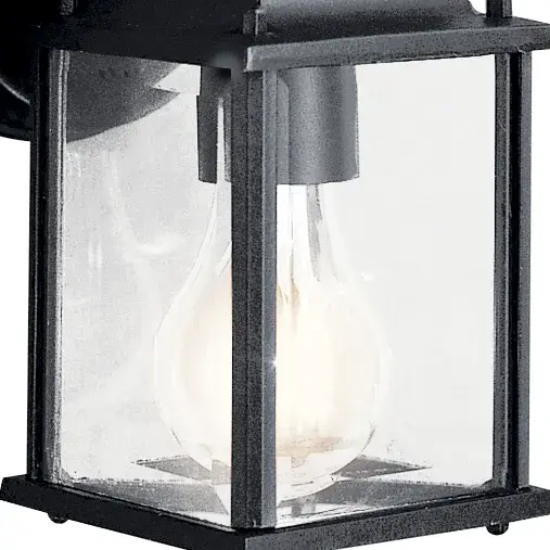 The Barrie outdoor wall light combines classic styling with practical durability. Its compact 8.5" height and clear beveled glass make it ideal for smaller outdoor spaces while maintaining traditional charm. - alternate view