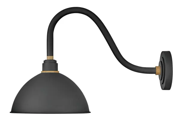 The Foundry Dome combines classic barn light styling with contemporary LED technology. Its textured black aluminum construction and knurled brass details create an authentic industrial aesthetic that works equally well indoors and out.