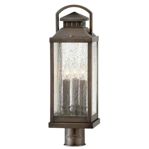 The Revere LED Post Lantern delivers timeless traditional charm with solid brass construction and clear seedy glass. Its faux candle sleeves and candelabra bulbing create an authentic coach lantern aesthetic perfect for outdoor entryways.