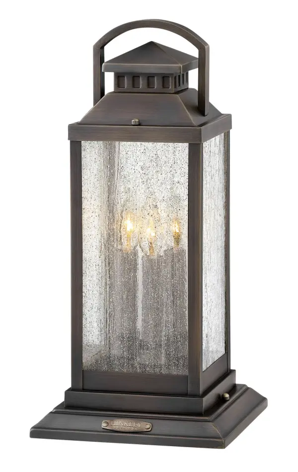 The Revere LED Pier Mount delivers timeless coach lantern styling in solid brass construction with clear seedy glass panels. Faux candle sleeves and LED candelabra bulbs create an authentic period appearance while providing modern energy efficiency.