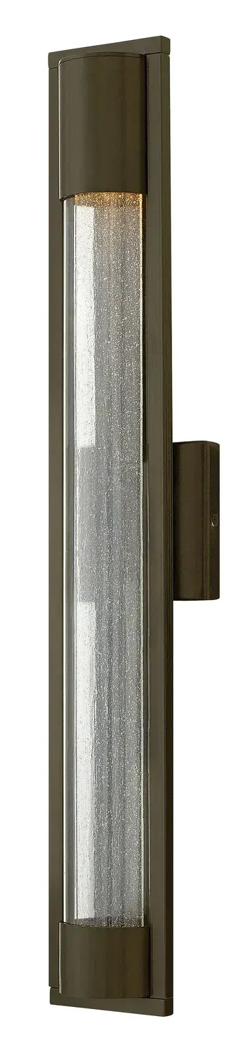 The Mist LED wall sconce combines sleek contemporary design with practical outdoor functionality. Its distinctive seedy glass panel encased in clear acrylic creates visual interest while the solid aluminum construction ensures durability. Dark Sky and ADA compliant, making it ideal for both residential and commercial applications.