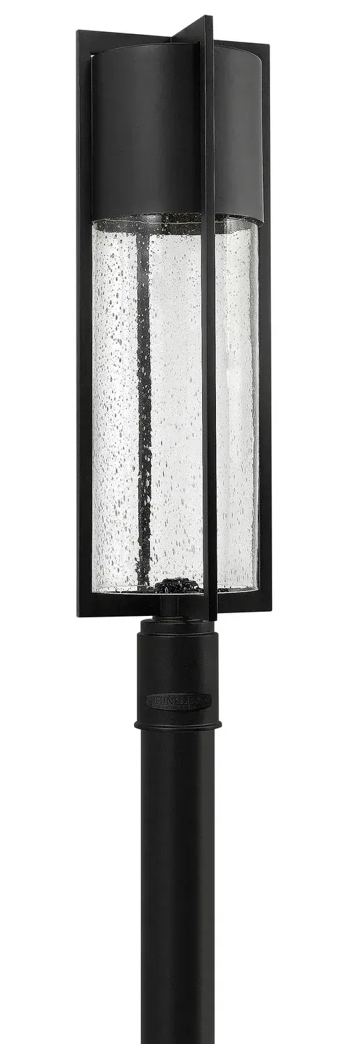 The Shelter LED Post Lantern delivers modern minimalist style with practical outdoor performance. Its aluminum construction and clear seedy glass create dramatic light effects while meeting Dark Sky compliance standards.