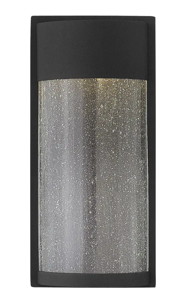 The Shelter LED wall sconce delivers minimalist modern style with functional outdoor lighting. Its aluminum construction and integrated LED provide energy-efficient illumination while the clear seedy glass adds texture and visual interest.