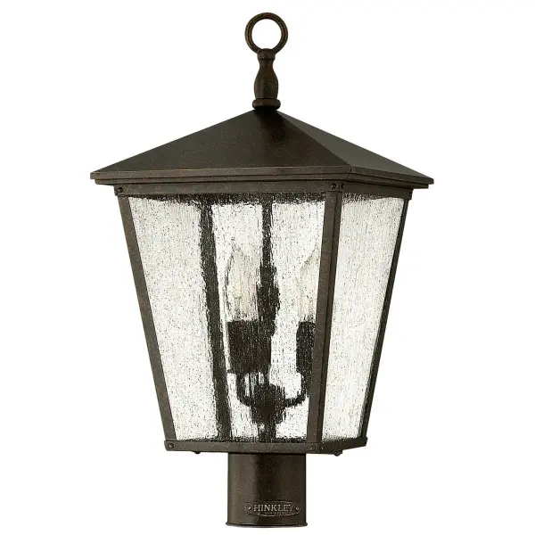 The Trellis LED Post Lantern brings Old World charm with its scrollwork detailing, cast loop finial, and authentic rivet accents. The Regency Bronze finish paired with seedy glass creates warm, inviting illumination.